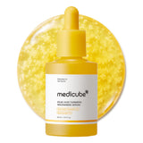 Medicube Kojic Acid Turmeric Capsule Serum in a clear glass bottle with dropper, showing the serum's smooth, yellowish liquid.