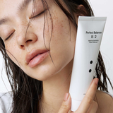 B : Lab Matcha Hydrating Foam Cleanser in a white tube with green accents, showing the product ready for use.