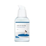 ROUND LAB Birch Juice Moisturising Serum 50ml in a clear glass bottle with a white pump dispenser and minimalist label.