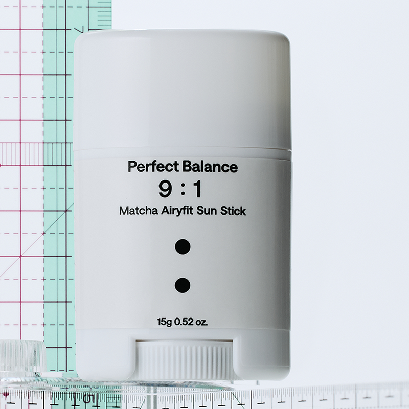 B : Lab Matcha Airyfit Sun Stick SPF50+ PA++++ sunscreen with green tea extract in a sleek stick format for easy sun protection.