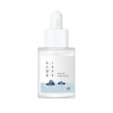 ROUND LAB 1025 Dokdo Ampoule 45g, clear glass bottle with dropper, containing nourishing serum for skin hydration and repair.