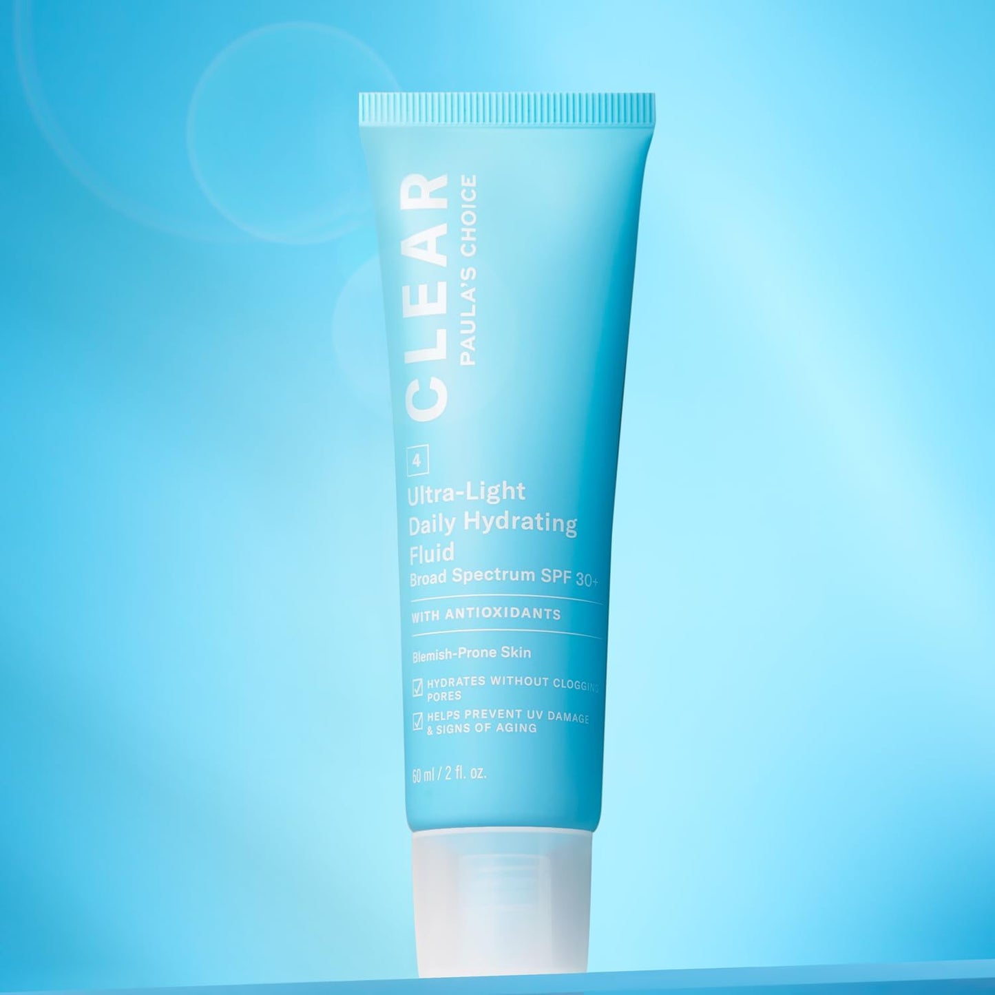 SKINZA Paula's Choice CLEAR Light Hydrating Fluid SPF 30 oil-free moisturizer in a white pump bottle.