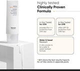 SKINZA minimalist SPF 50 light fluid sunscreen bottle with a sleek, modern design and clear labeling on a white background.