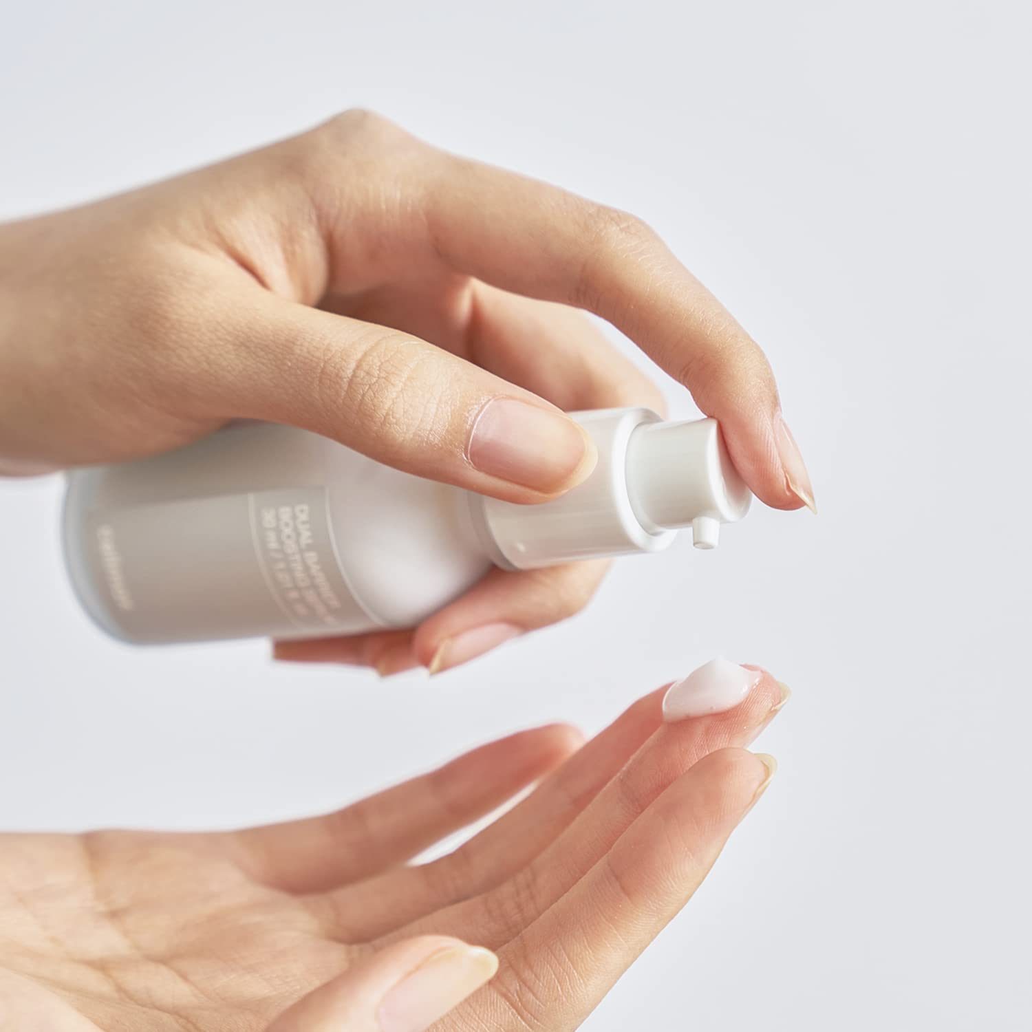 Celimax Dual Barrier Skin Boosting Serum bottle with dropper, showcasing the product for skin hydration and barrier support.