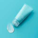 SKINZA Paula's Choice CLEAR Oil-Free Night Cream jar with white lid and label, smooth cream visible inside.