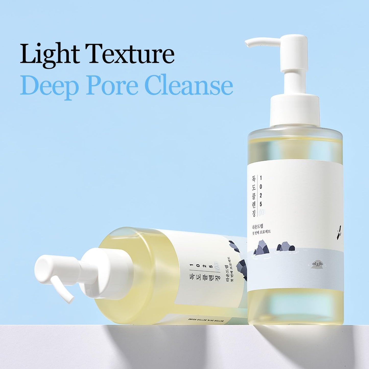 ROUND LAB 1025 Dokdo Cleansing Oil in a 200 ml bottle, featuring a clear face essence with a sleek design and label.