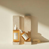SKINZA Madagascar Centella Ampoule bottle with label, clear glass container, and dropper for skincare application.