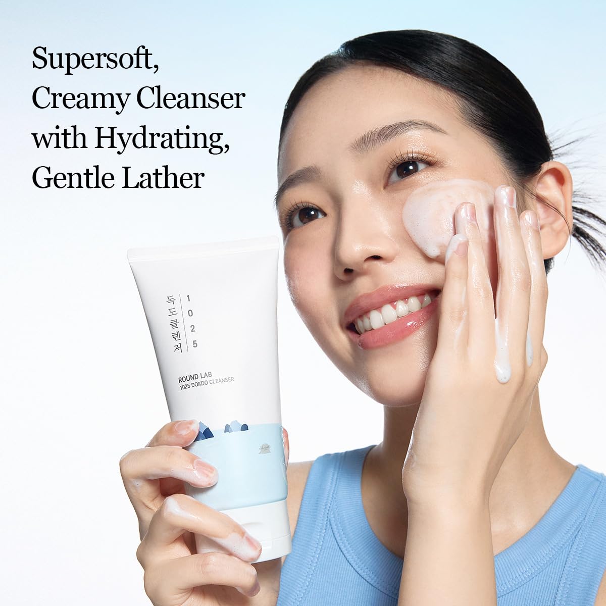 ROUND LAB 1025 Dokdo Cleanser in a white tube with blue accents, featuring the product label and cap, on a clean background