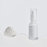 Celimax Dual Barrier Skin Boosting Serum in a clear glass bottle, with dropper applicator and white label.
