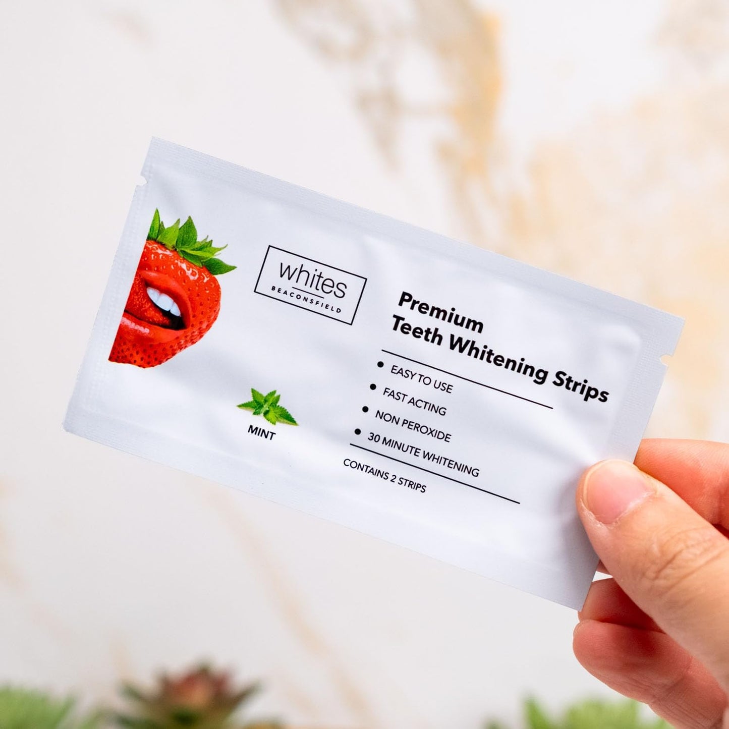 SKINZA Whites Beaconsfield non-peroxide whitening strips, 28-count 14-day kit for teeth whitening, shown in a close-up image.