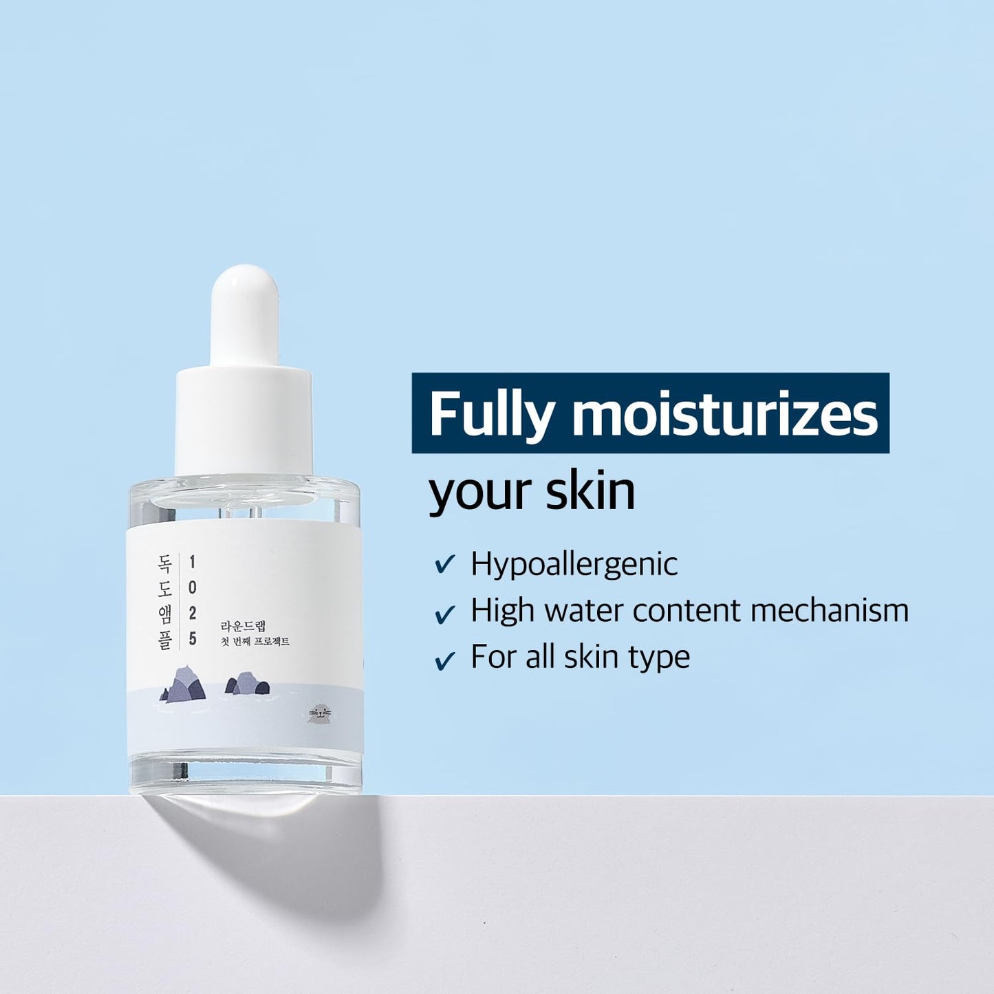 ROUND LAB 1025 Dokdo Ampoule 45g in a glass bottle with a pump, featuring a clear serum with a lightweight, moisturizing texture.