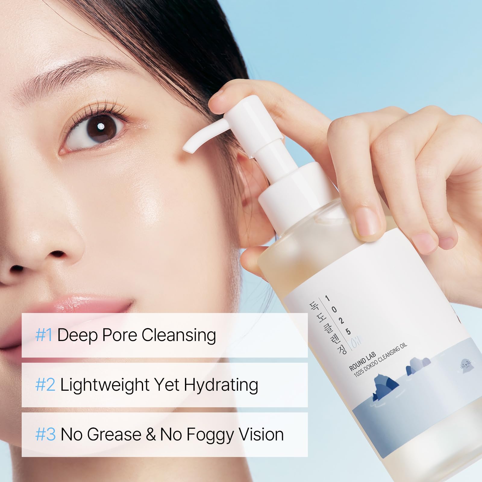ROUND LAB 1025 Dokdo Cleansing Oil 200 ml in a clear bottle, showing the face essence with a pump dispenser and product label.