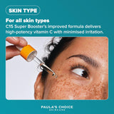 SKINZA Paula's Choice C15 Super Booster serum bottle with dropper, featuring bright orange packaging and clear labeling.