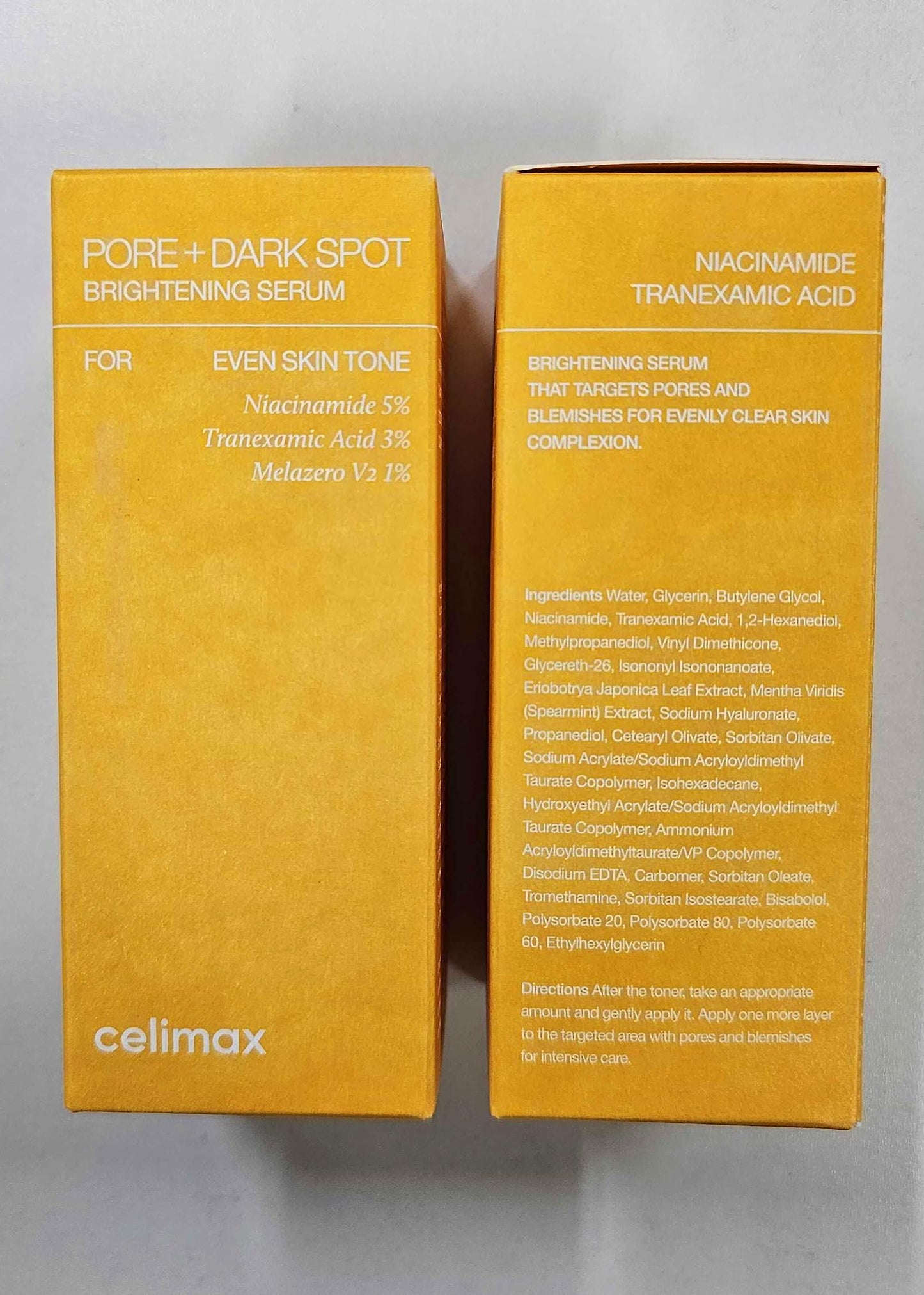 Celimax Pore Dark Spot Brightening Serum Gel in a clear tube with a white cap, showcasing its lightweight gel texture.