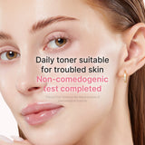 Medicube PDRN Pink Niacinamide Milky Toner in a clear bottle with a pink label, showing the toner’s smooth, milky texture.