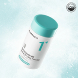 Container of nubuz.n B5 Active Drying Powder with a blue cap on a light blue background