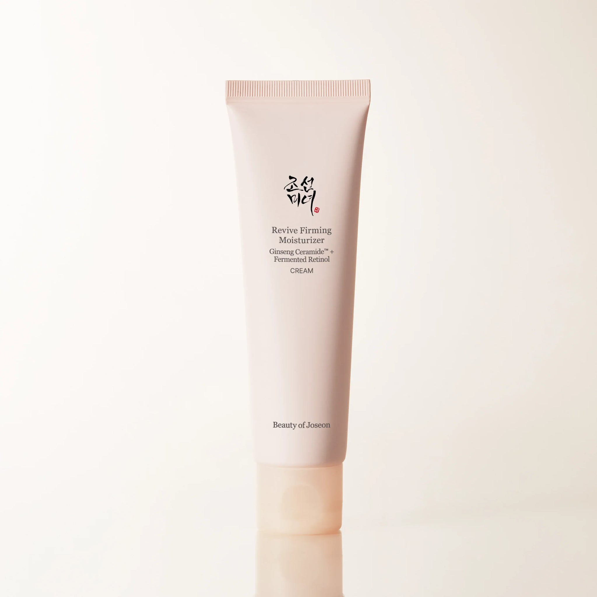 Beauty of Joseon Revive Firming Moisturizer with Ginseng and Retinol for face care, shown in a sleek jar.