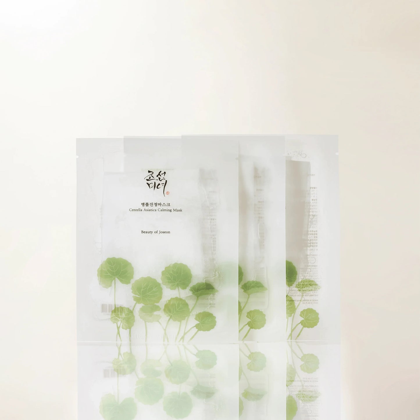 Beauty of Joseon Centella Asiatica Calming Face Mask sheets laid out in a box, showcasing the calming skincare product.