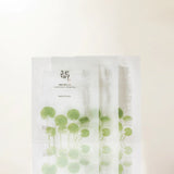 Beauty of Joseon Centella Asiatica Calming Face Mask sheets laid out in a box, showcasing the calming skincare product.