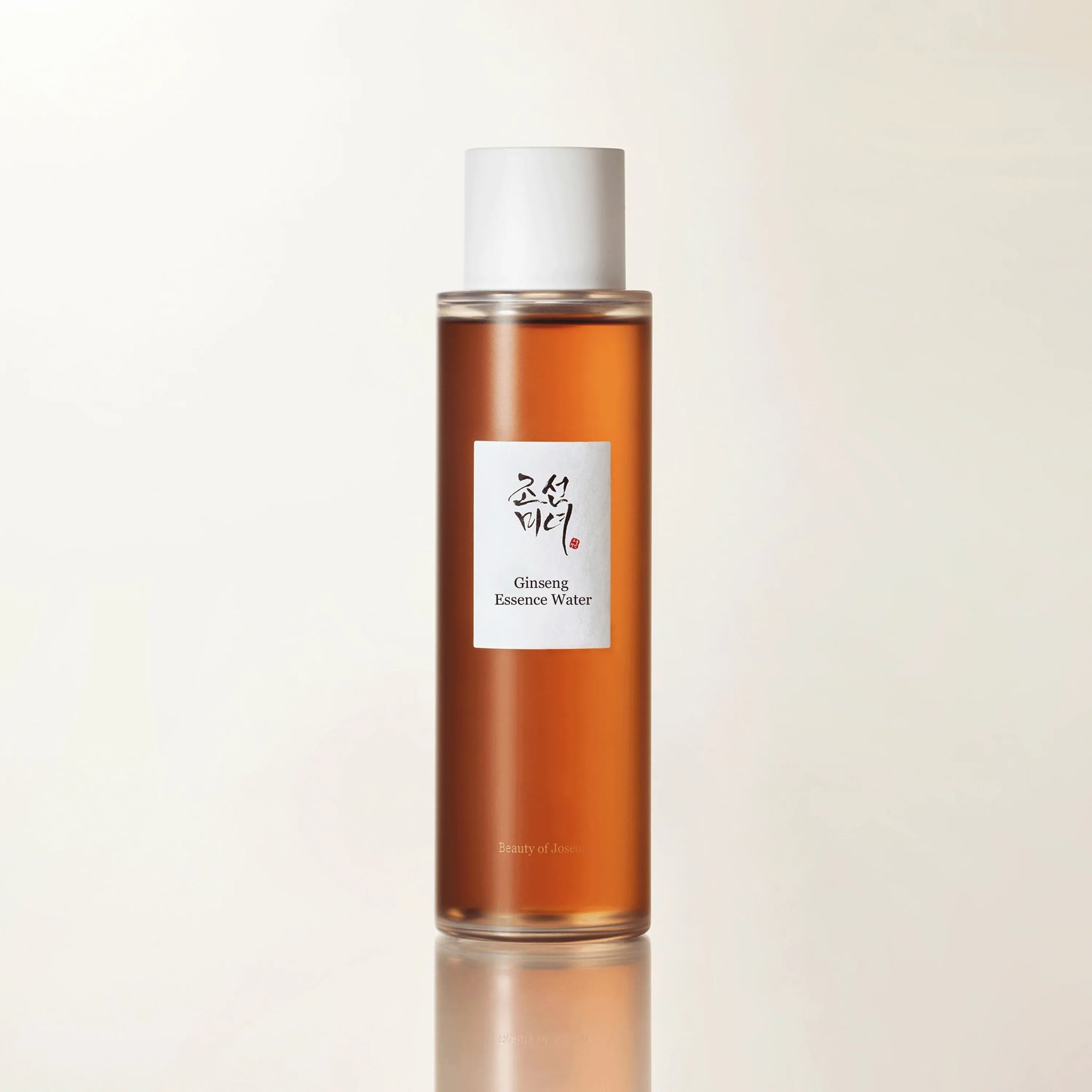 Front view of Beauty of Joseon Ginseng Essence Water in a clear bottle, showcasing the face care product with a minimalist design.
